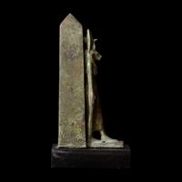 An Egyptian Bronze Lion-Headed Goddess and Obelisk