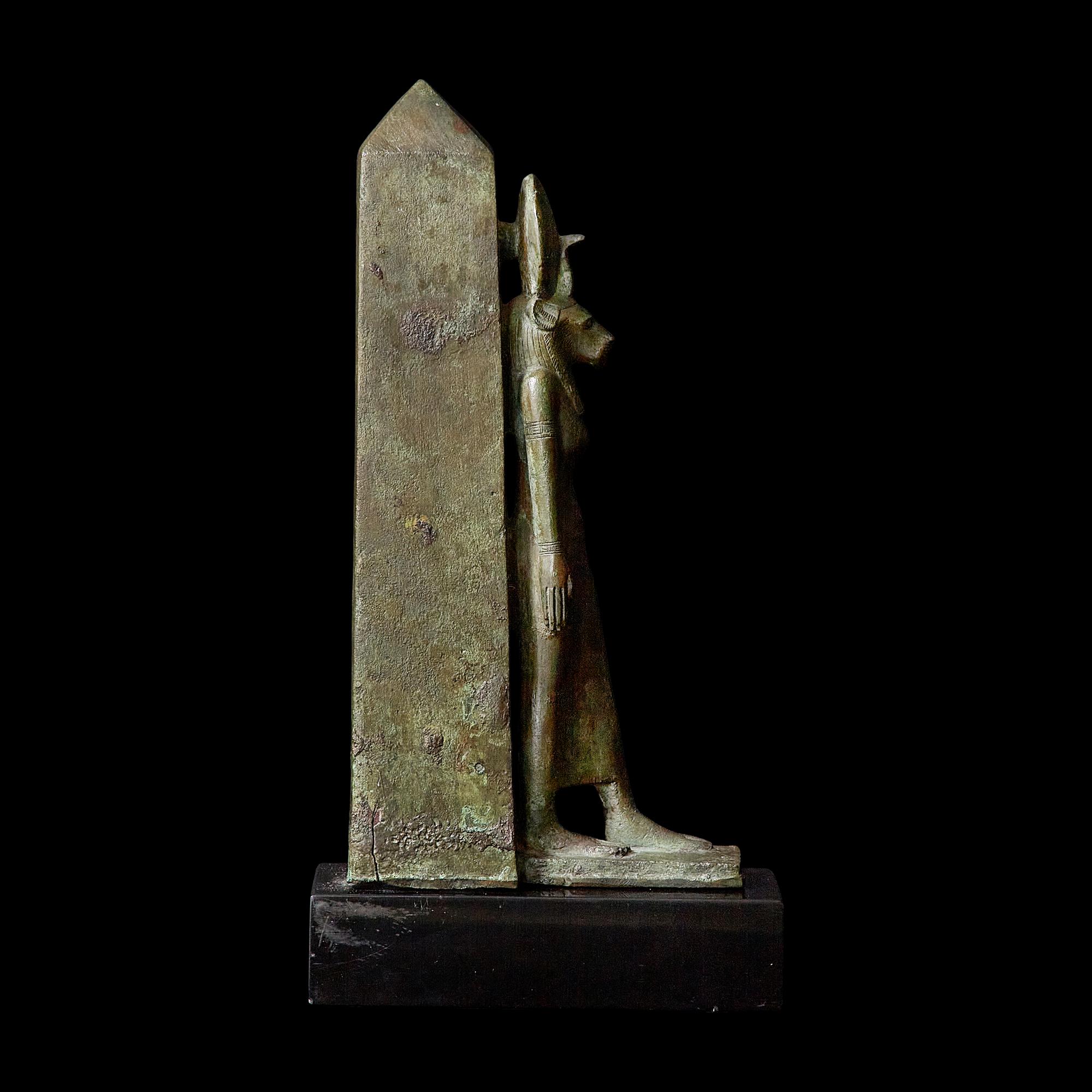An Egyptian Bronze Lion-Headed Goddess and Obelisk