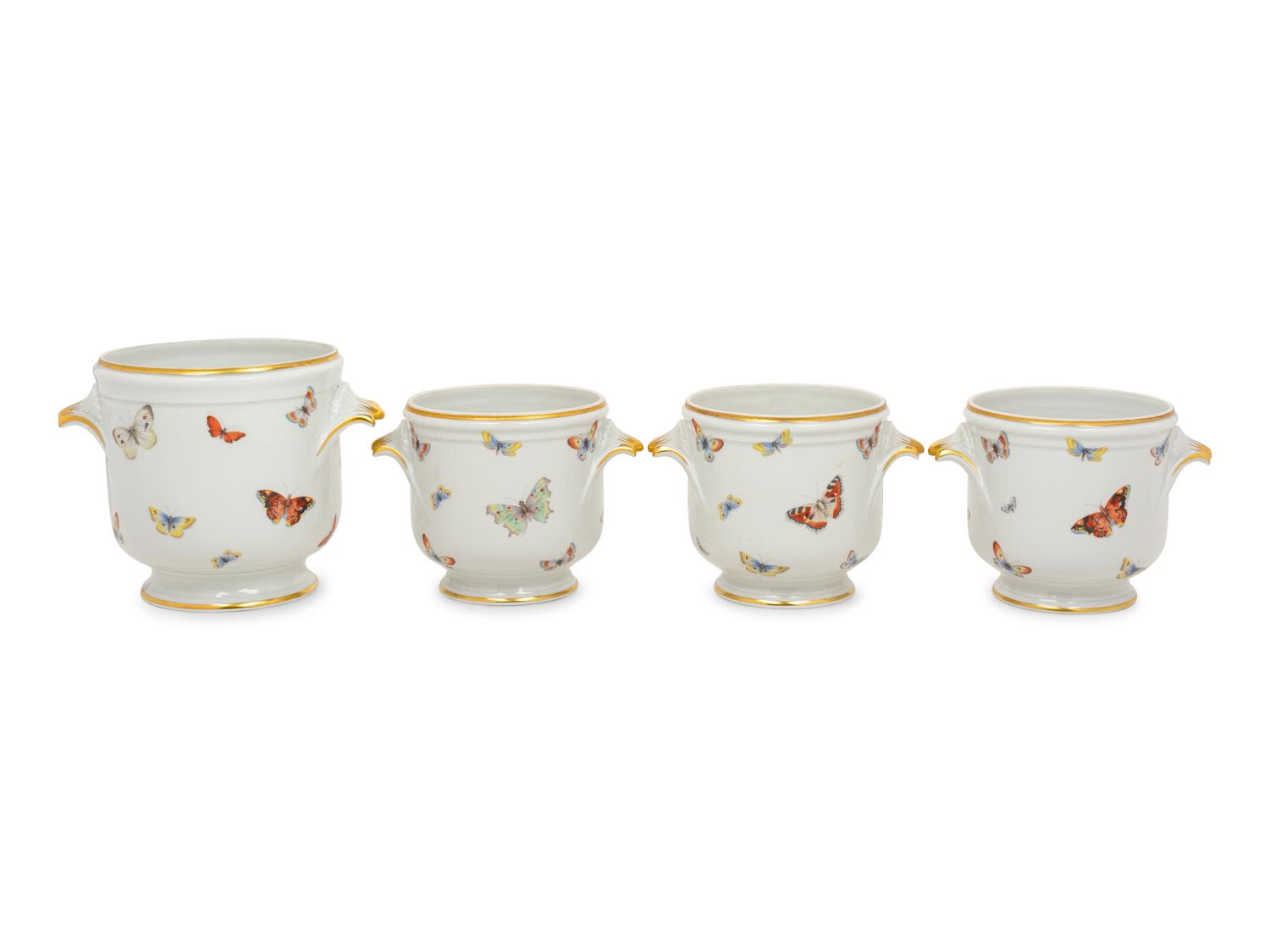 A Set of Four Limoges Porcelain Cache Pots