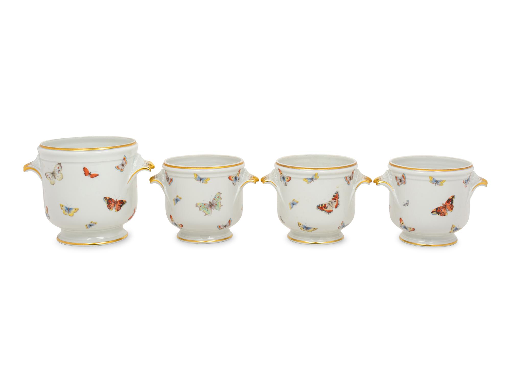 A Set of Four Limoges Porcelain Cache Pots
