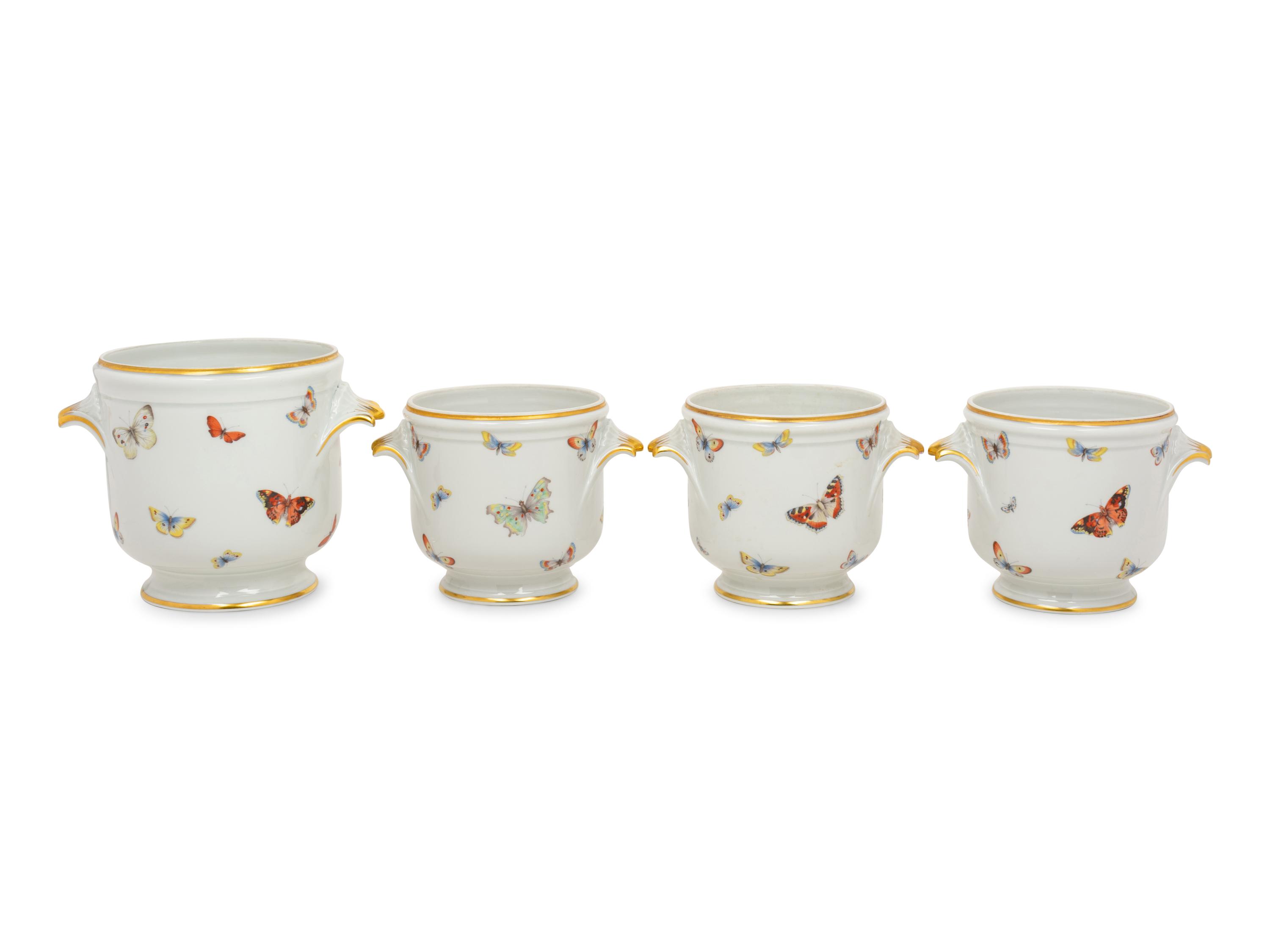 A Set of Four Limoges Porcelain Cache Pots