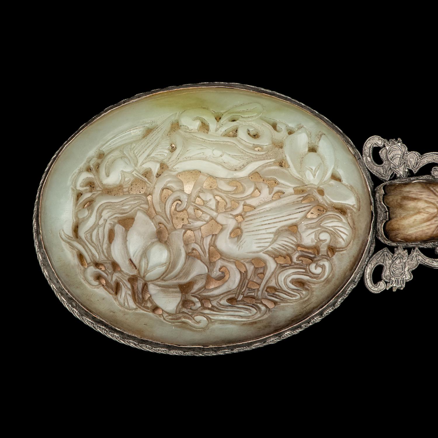 A Chinese White and Russet Jade Inset Hand Mirror and French Mother-of-Pearl Opera Glasses 銅嵌貝母歌劇望遠鏡及銀鑲玉手把鏡