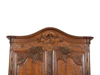 A French Provincial Carved Oak Armoire