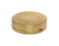 A 14 Karat Yellow Gold Pill Box, 20th Century, of circular form with an engine turned edge.
