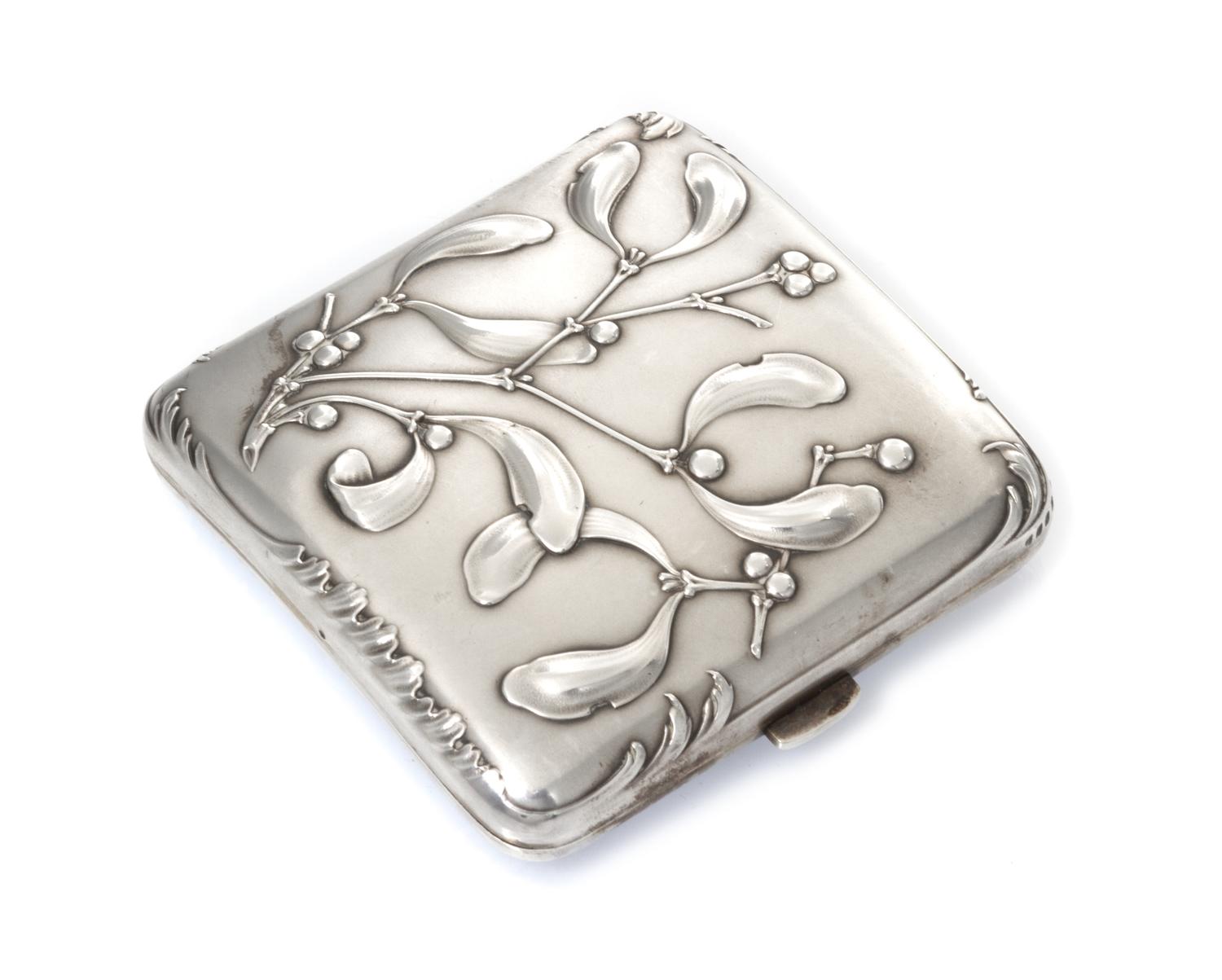 A French Art Nouveau Silver Cigarette Case, Maker's mark obscured, of square form, the case worked with foliate and berry motifs.