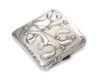 A French Art Nouveau Silver Cigarette Case, Maker's mark obscured, of square form, the case worked with foliate and berry motifs.