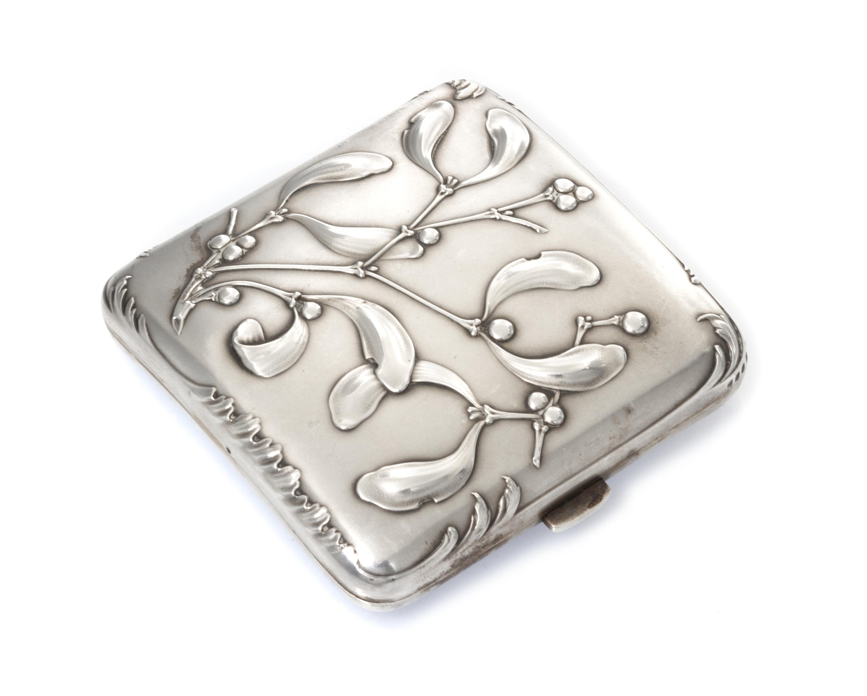 A French Art Nouveau Silver Cigarette Case, Maker's mark obscured, of square form, the case worked with foliate and berry motifs.