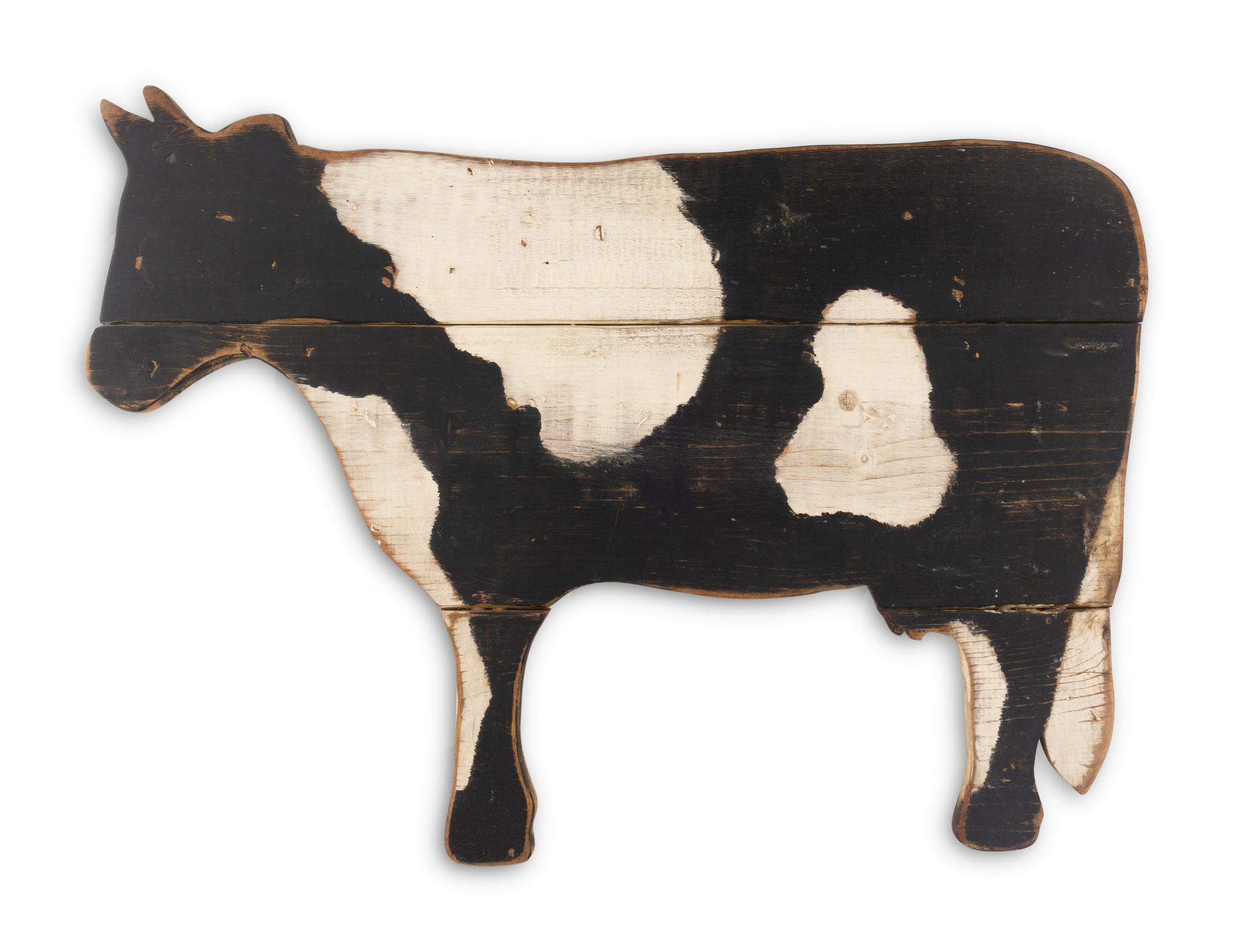 A Carved Wood Cow Form Trade Sign