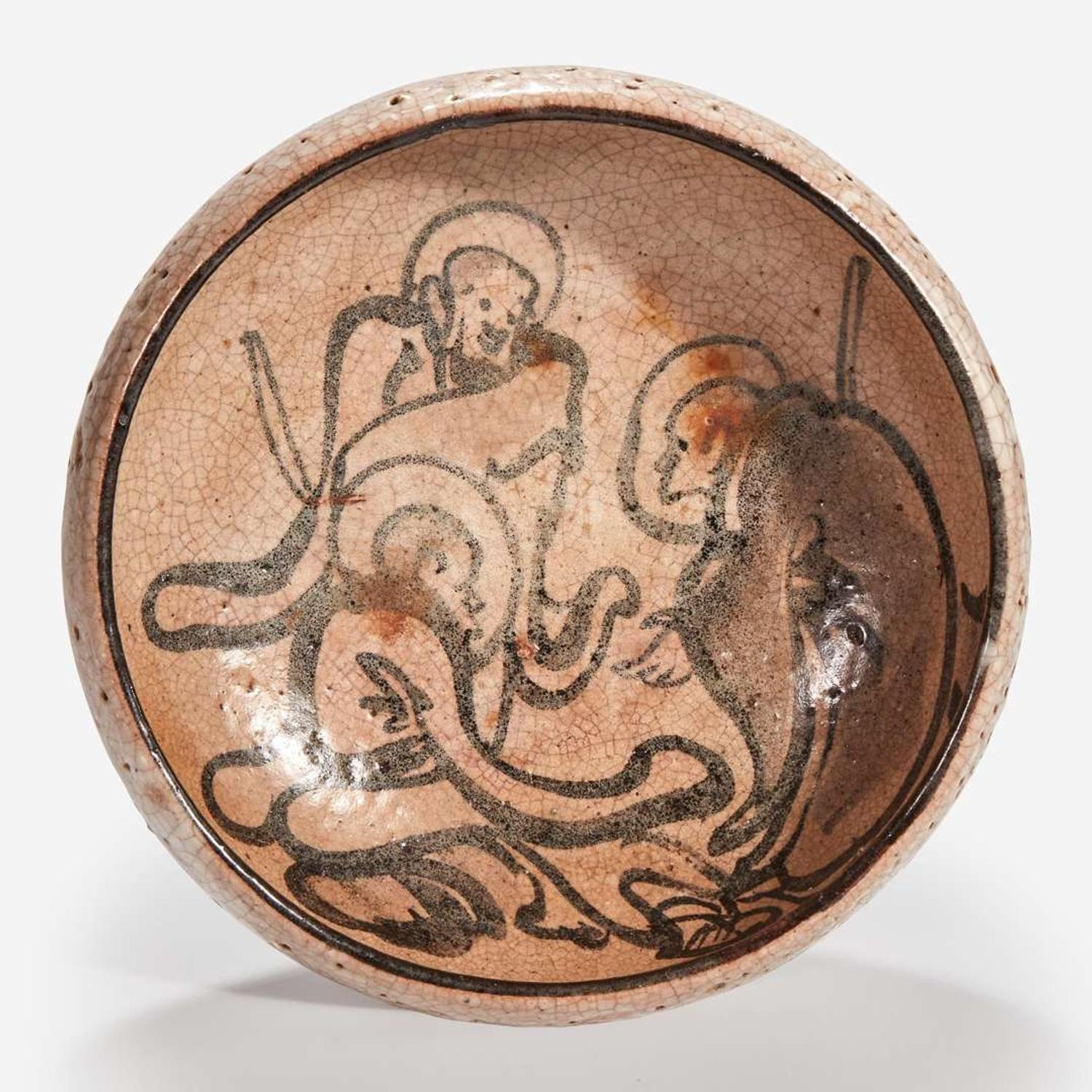 A Japanese iron-brown decorated small stoneware dish Signed "Kenzan"