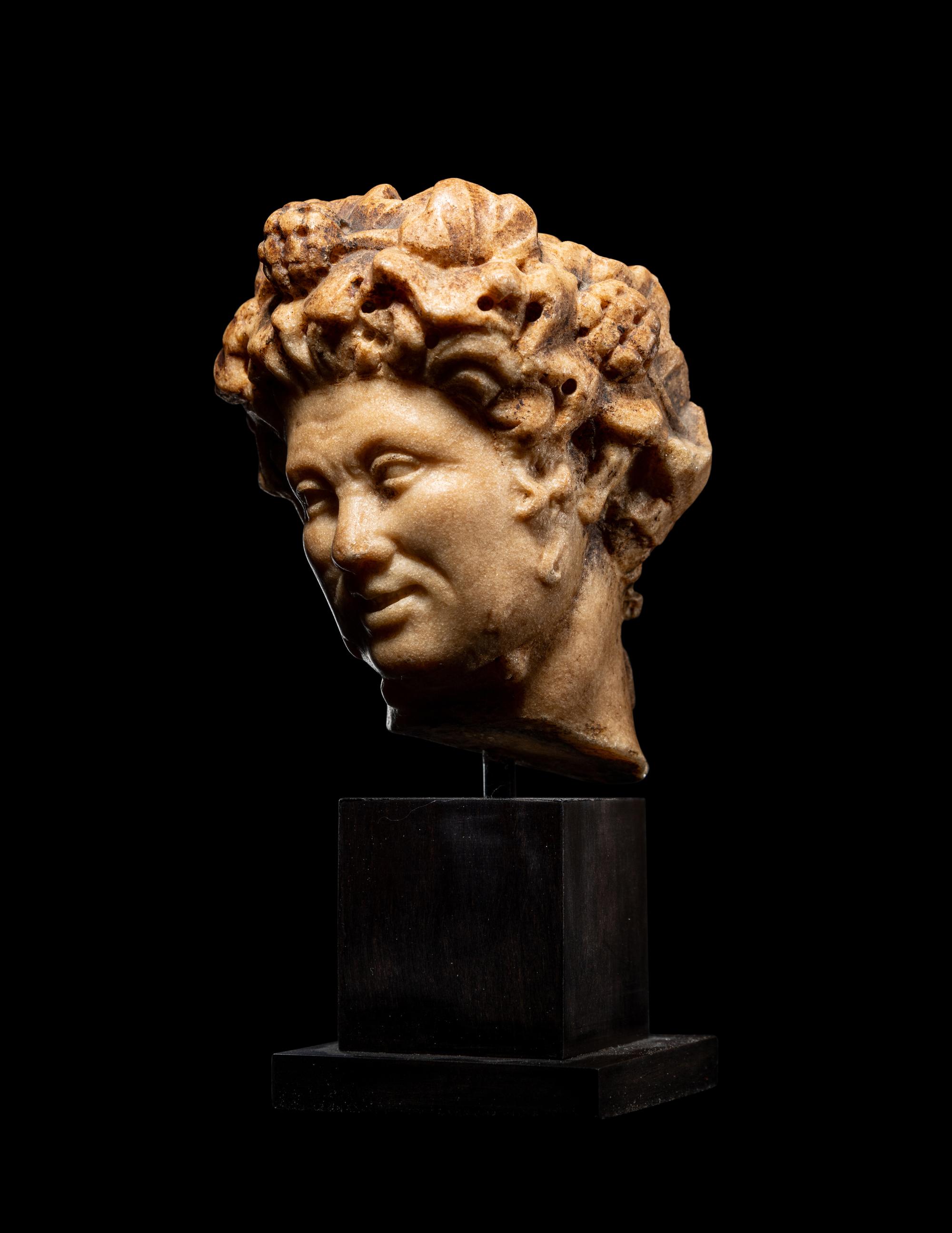 A Roman Marble Head of a Satyr
