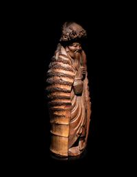 A Japanese Carved Bamboo Figure of an Elderly