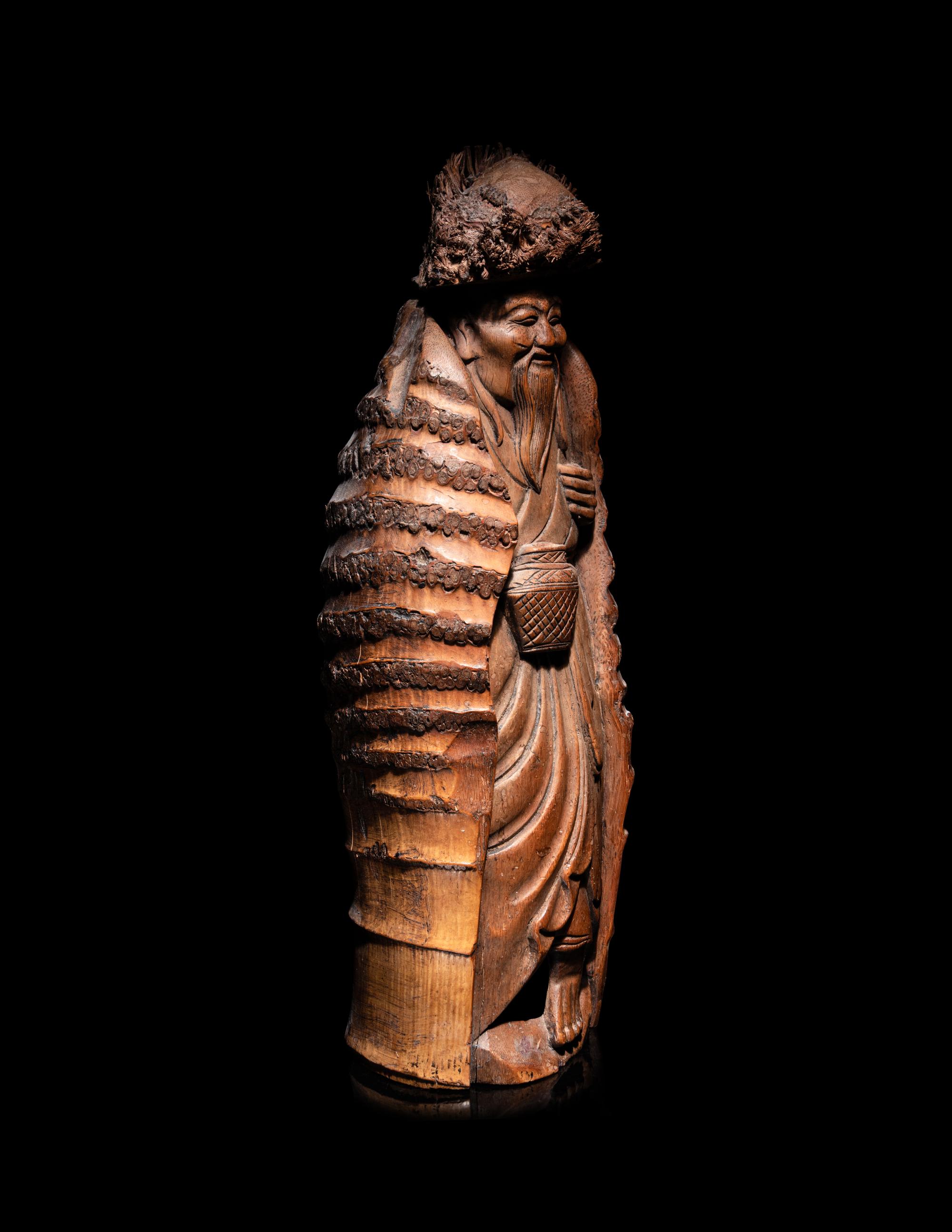 A Japanese Carved Bamboo Figure of an Elderly