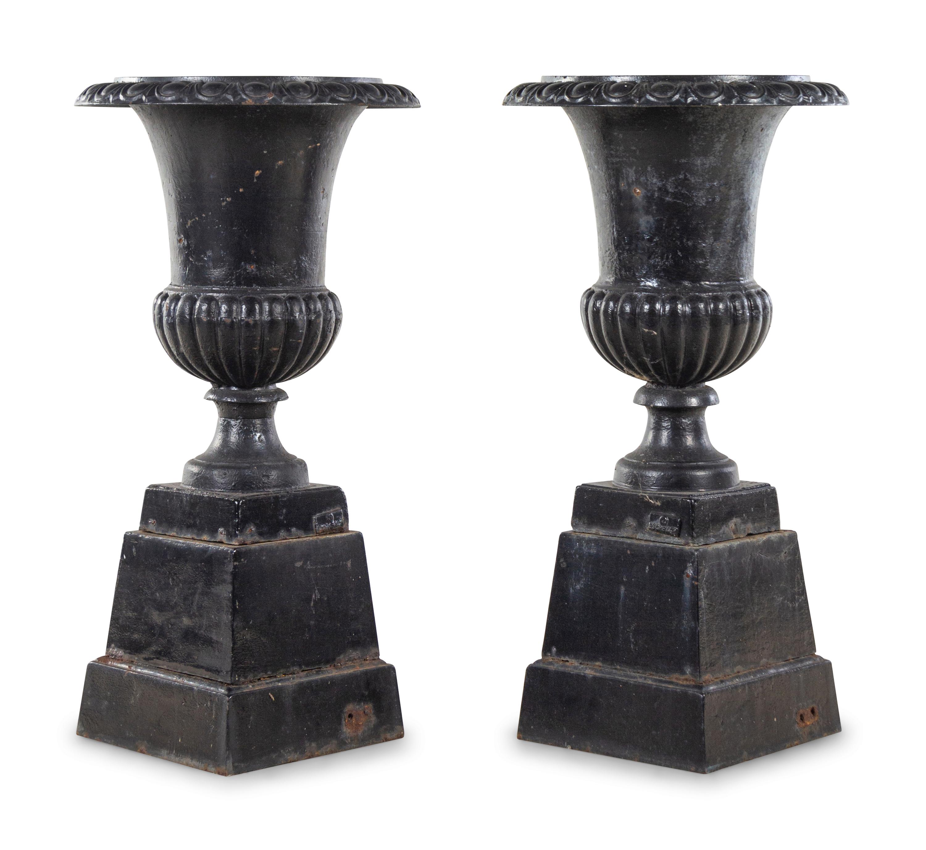 A Pair of German Painted Iron Garden Urns