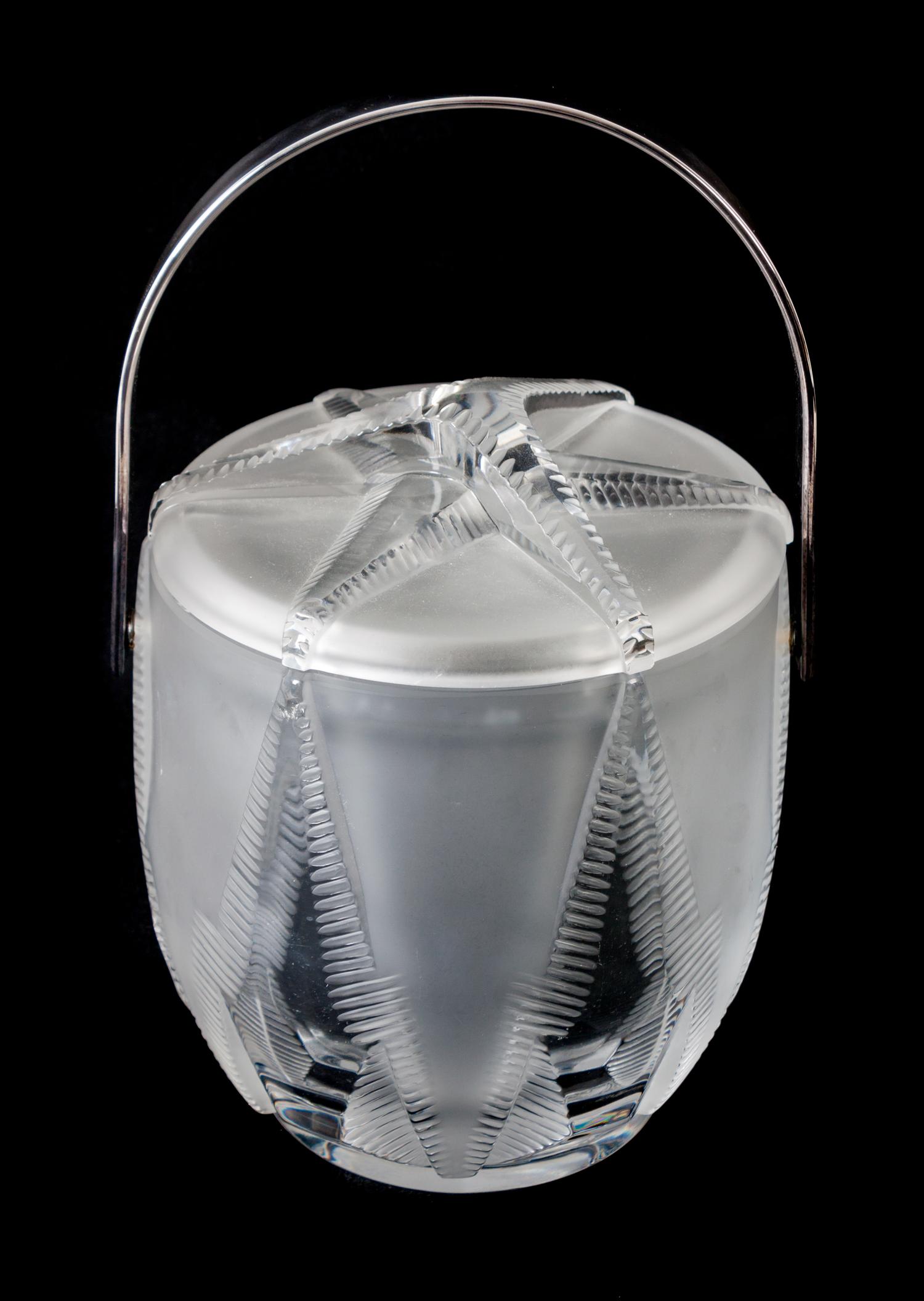 A Lalique Molded and Frosted Glass Isothermic Ice Bucket Height 9 1/2 inches.
