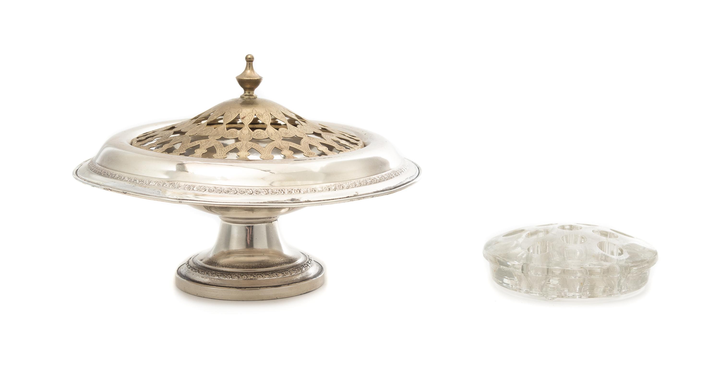 An American Silver Centerpiece Bowl, Maker's Mark Obscured, having a floral and foliate decorated border and foot and an associated pie