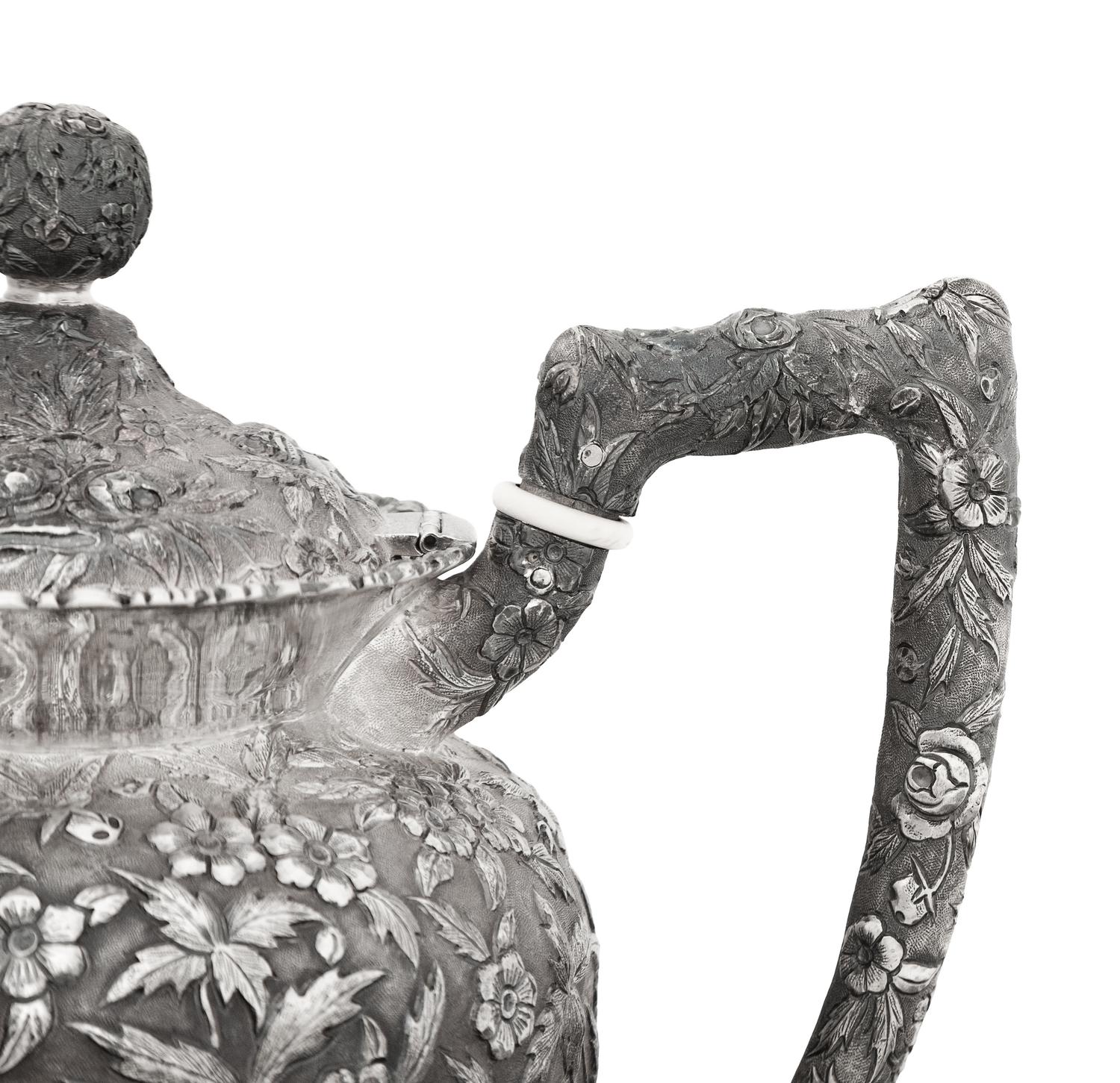 An American Silver Repoussé Three-Piece Coffee Service