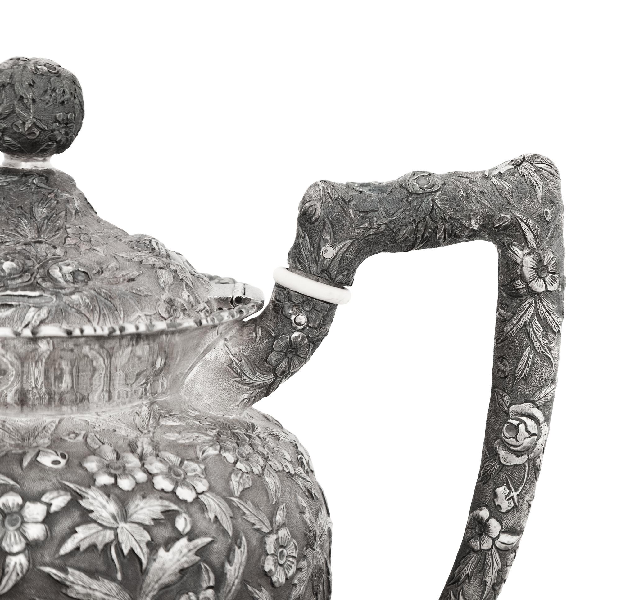 An American Silver Repoussé Three-Piece Coffee Service