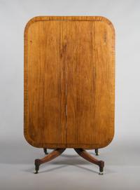 An English Mahogany Breakfast Table, Height 27 3/4 x width 48 3/4 x depth 33 3/4 inches.