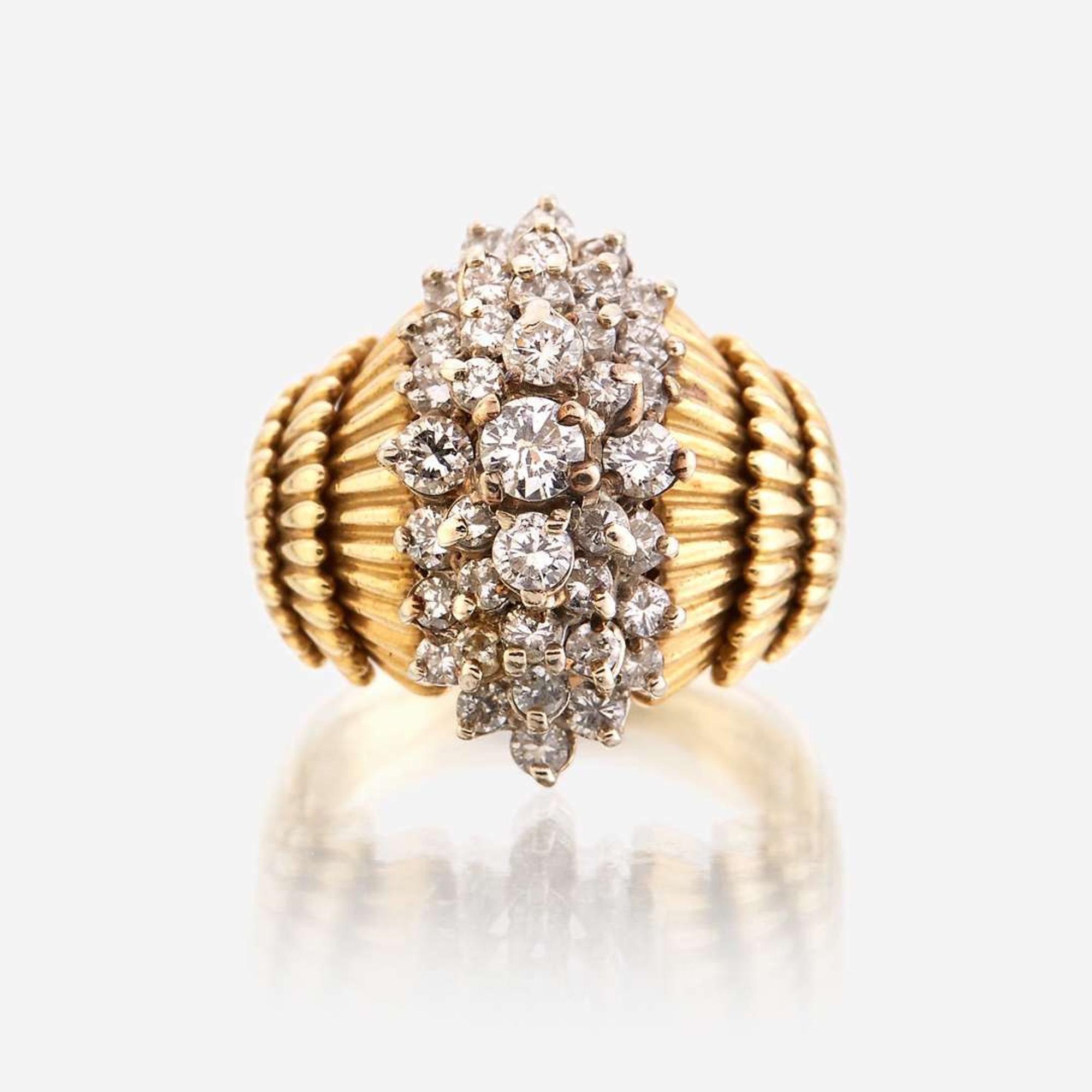 An eighteen karat gold and diamond ring