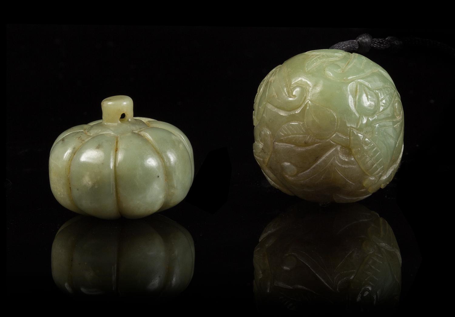 Two Carved Jade Pebbles Width of first 1 3/8 inches.