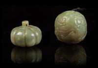 Two Carved Jade Pebbles Width of first 1 3/8 inches.
