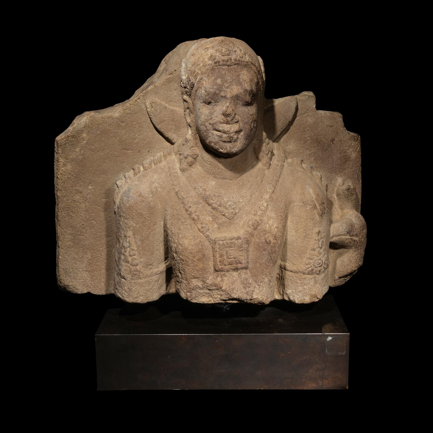 An Indonesian Volcanic Stone Bust of Kumara, Java, 9th/10th Century