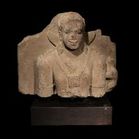 An Indonesian Volcanic Stone Bust of Kumara, Java, 9th/10th Century