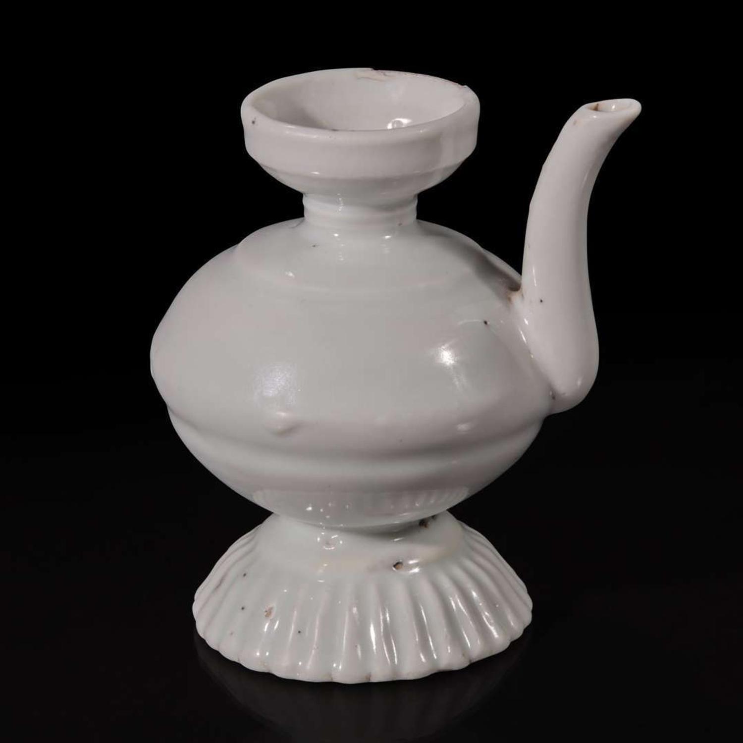A small Chinese white glazed porcelain ewer Ming dynasty or earlier