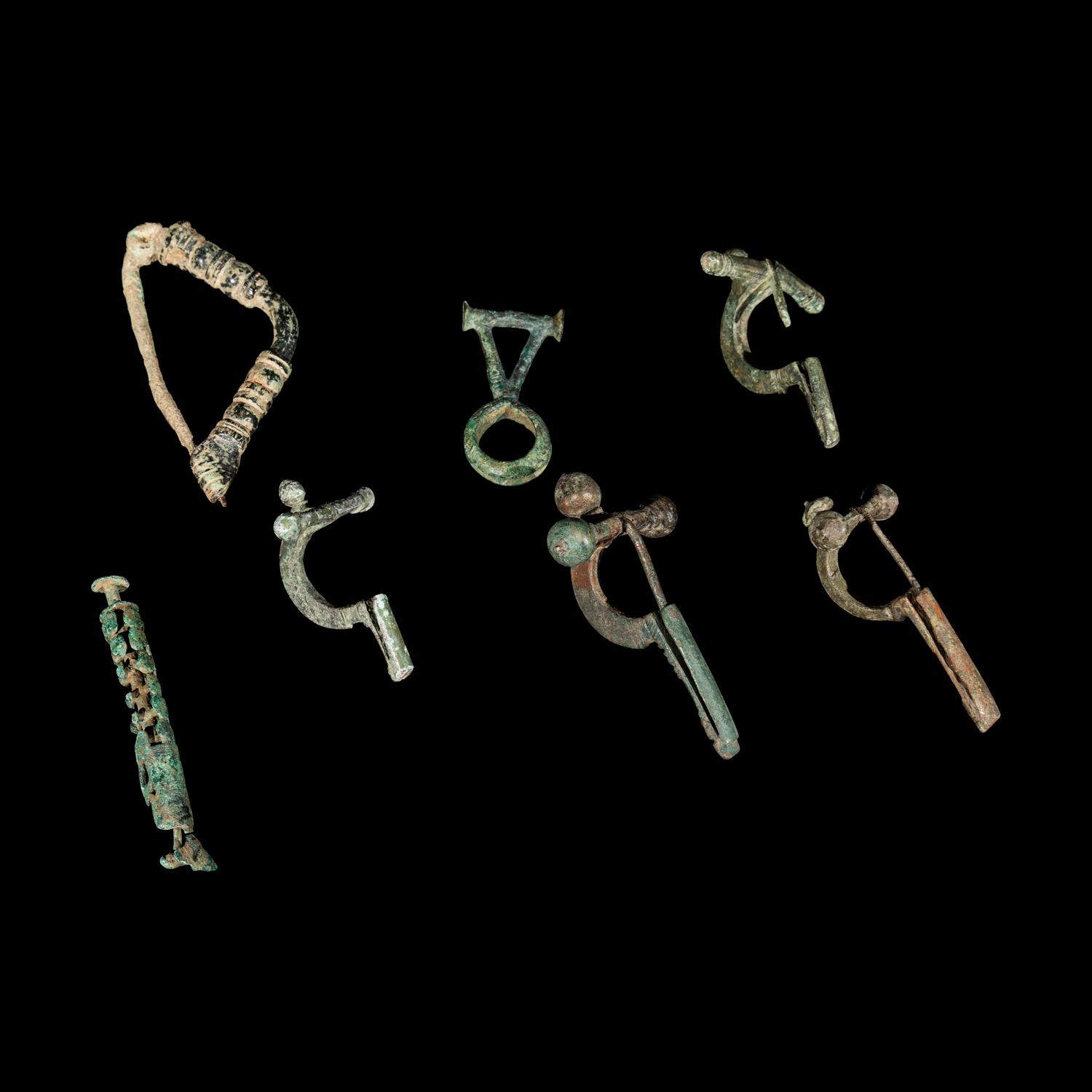A Group of 5 Greco-Roman Fibulae and 2 Geometric Bronze Objects