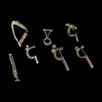 A Group of 5 Greco-Roman Fibulae and 2 Geometric Bronze Objects