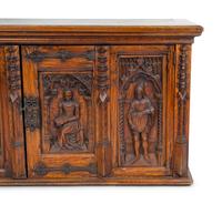 A Renaissance Revival Carved Oak Trunk with Iron Mounts — 19TH/20TH CENTURY