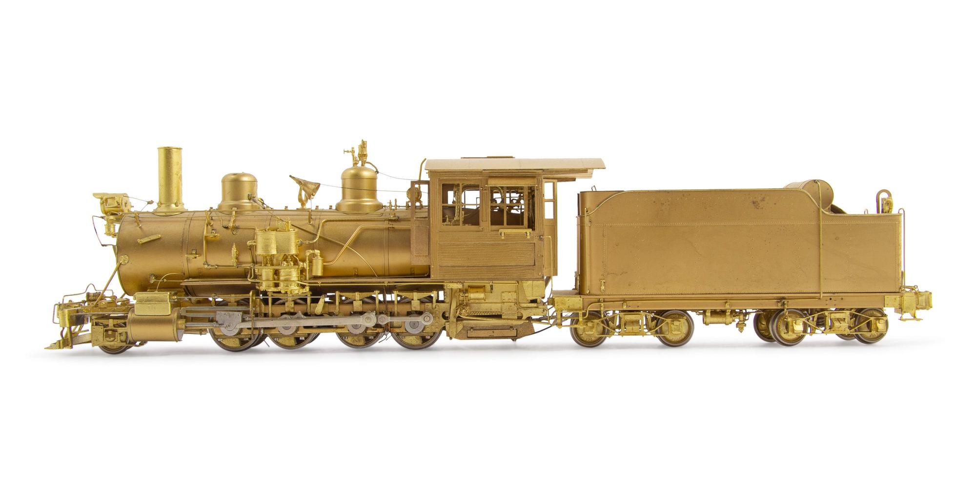 A Group of Four Brass Locomotives and Three Tenders