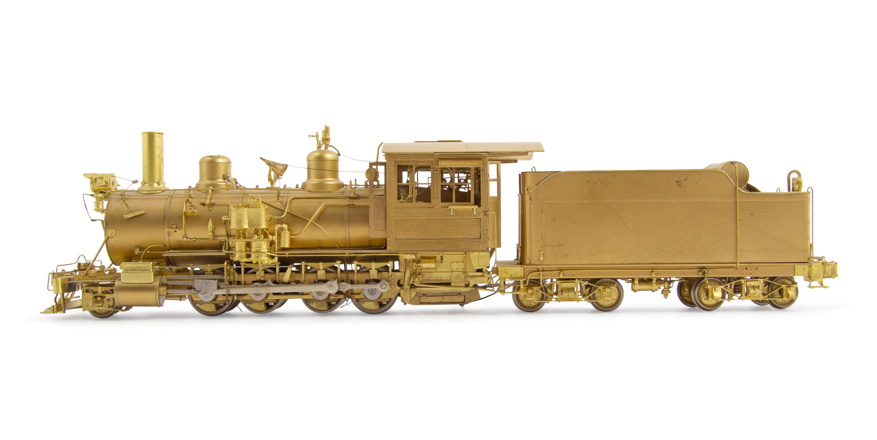 A Group of Four Brass Locomotives and Three Tenders