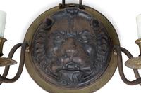 A Pair of Regency Style Iron and Brass Sconces with Lion Masks and Serpent Branches — 19TH CENTURY