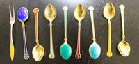 A Set of Eight Norwegian Enameled Silver Demitasse Spoons, David Andersen, together with an enameled Danish enameled lemon fork.