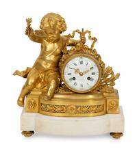 A Louis XVI Style Gilt Bronze and White Marble Mantel Clock