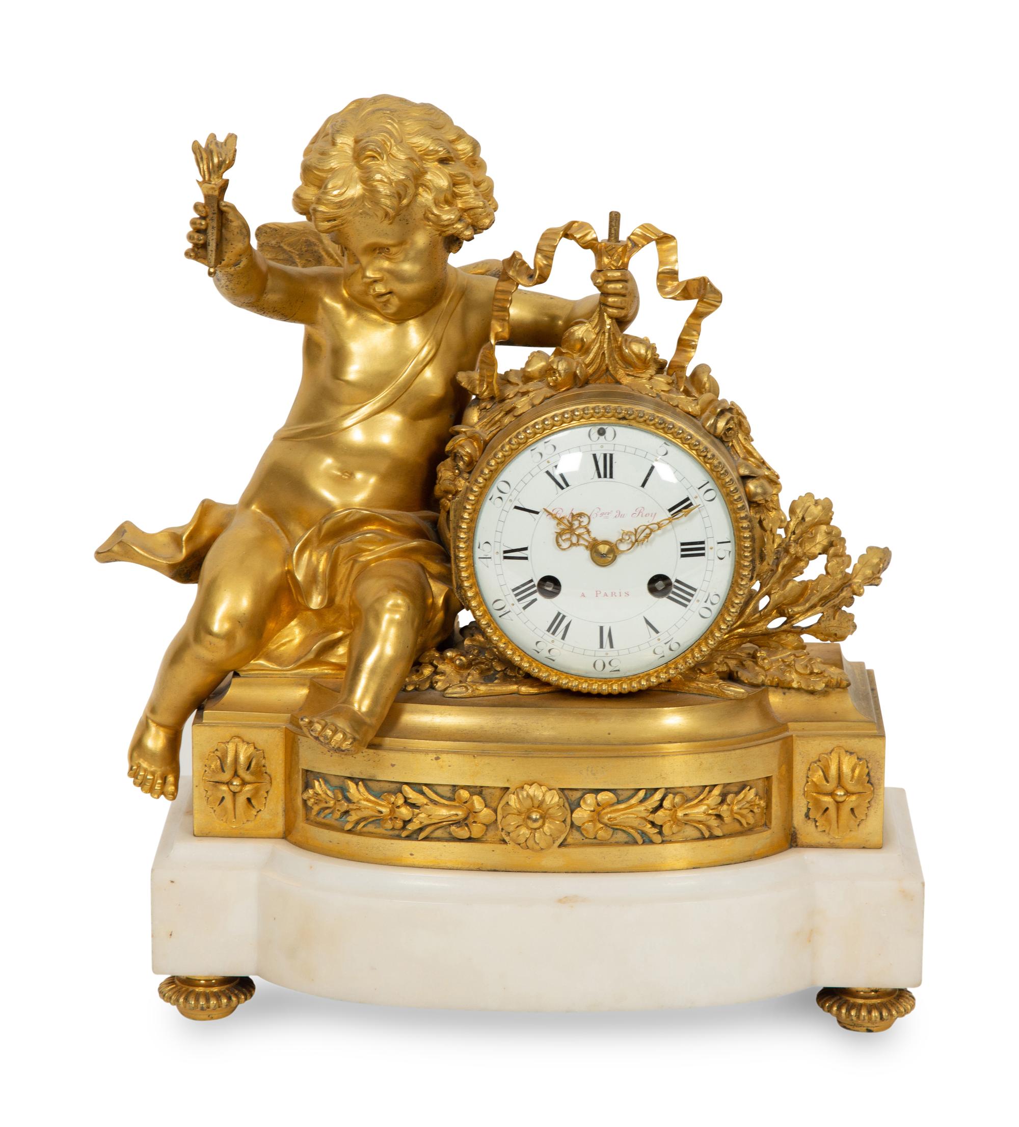 A Louis XVI Style Gilt Bronze and White Marble Mantel Clock