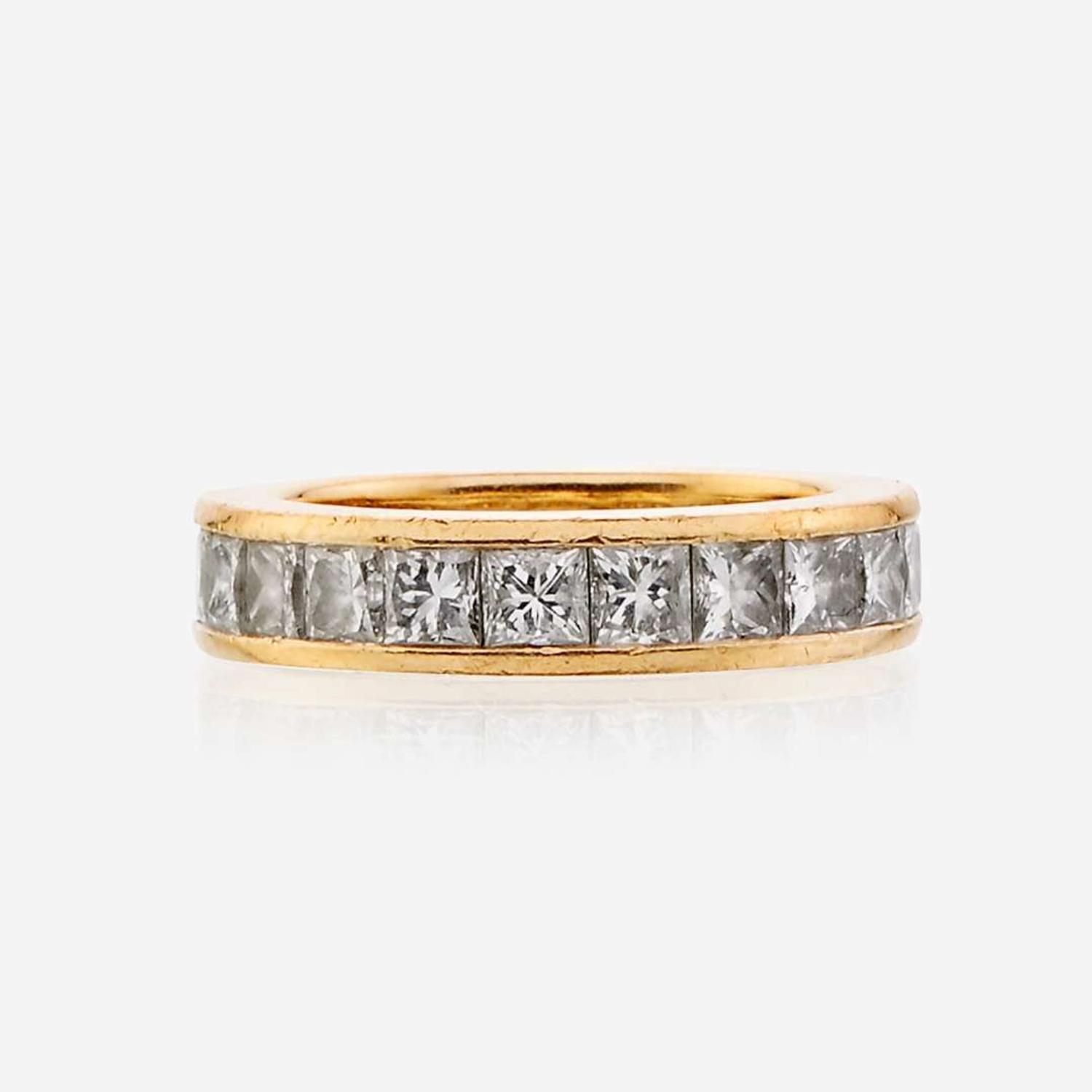 An eighteen karat gold and diamond eternity band