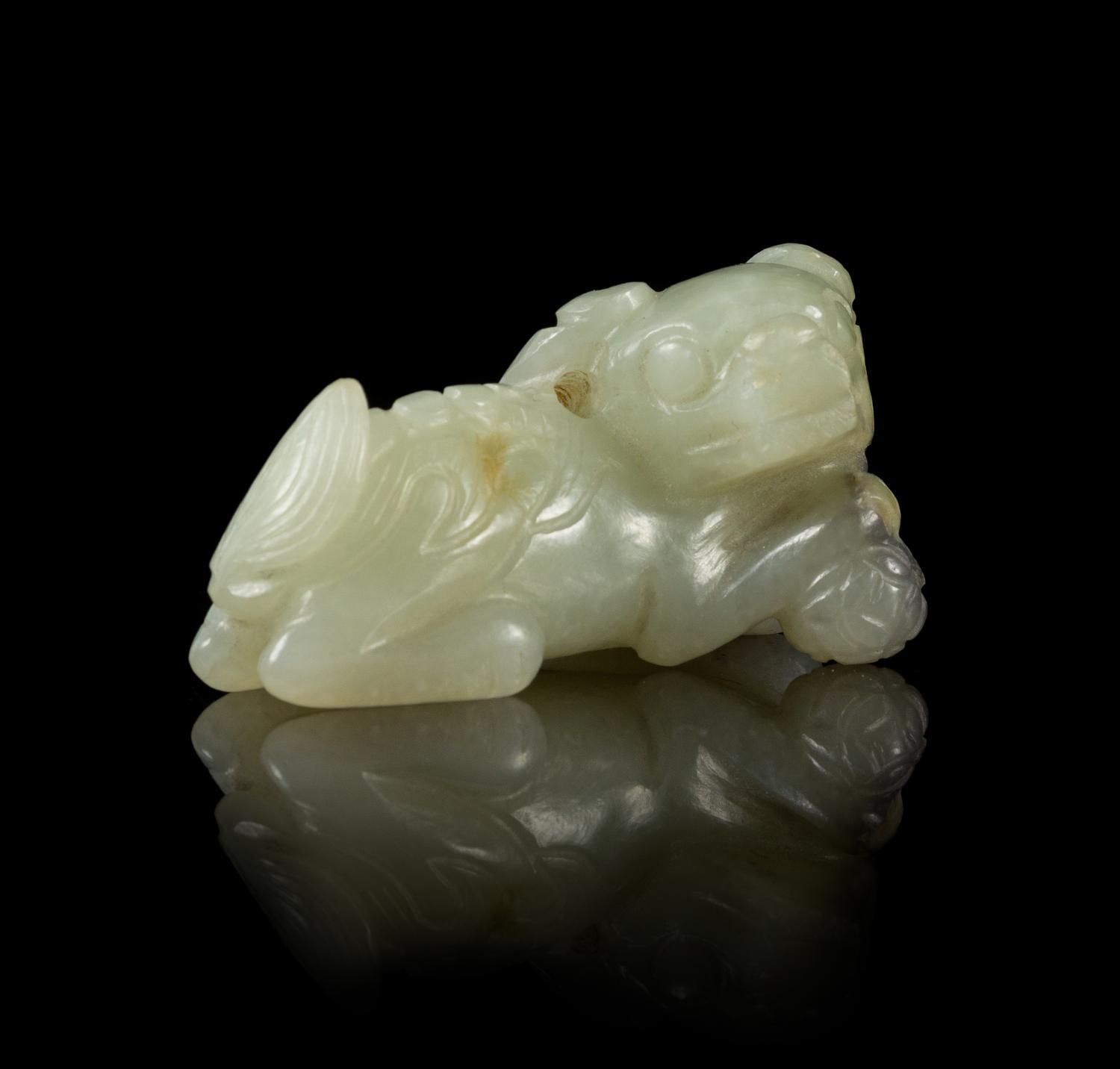A Pale Celadon Jade Figure of a Fu Lion Length 1 7/8 inches. — 18TH/19TH CENTURY