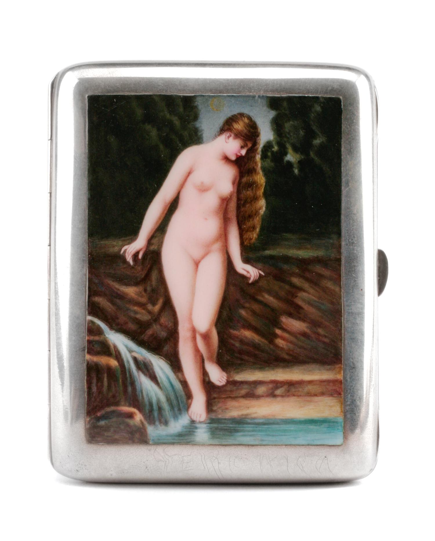 A German Enameled Silver Cigarette Case, Late 19th/Early 20th Century, the lid decorated with a nude figure bathing in a brook.