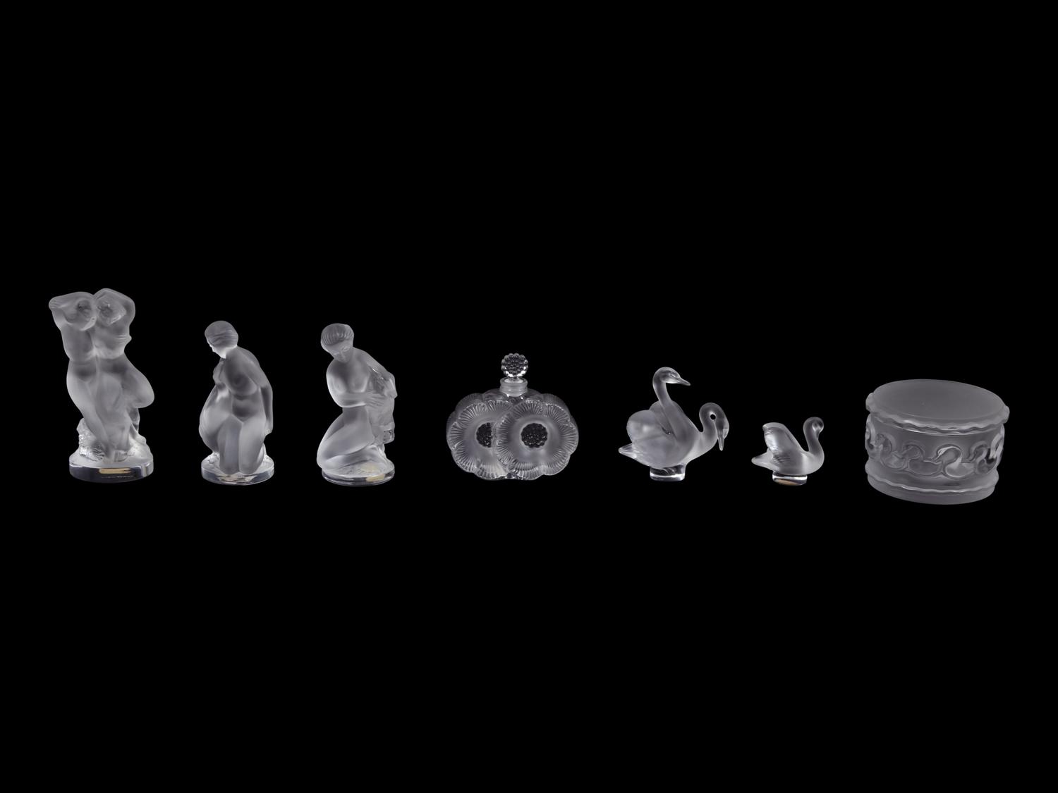 A Collection of Seven Lalique Glass Articles Height of tallest figure 5 1/2 inches.