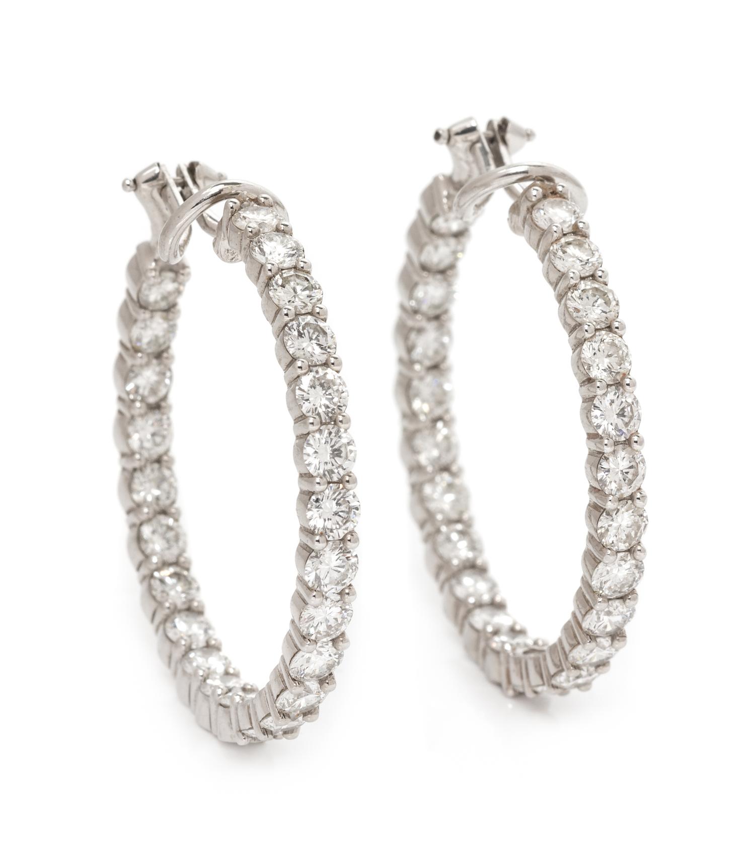 A Pair of White Gold and Diamond Hoop Earclips, 9.70 dwts.