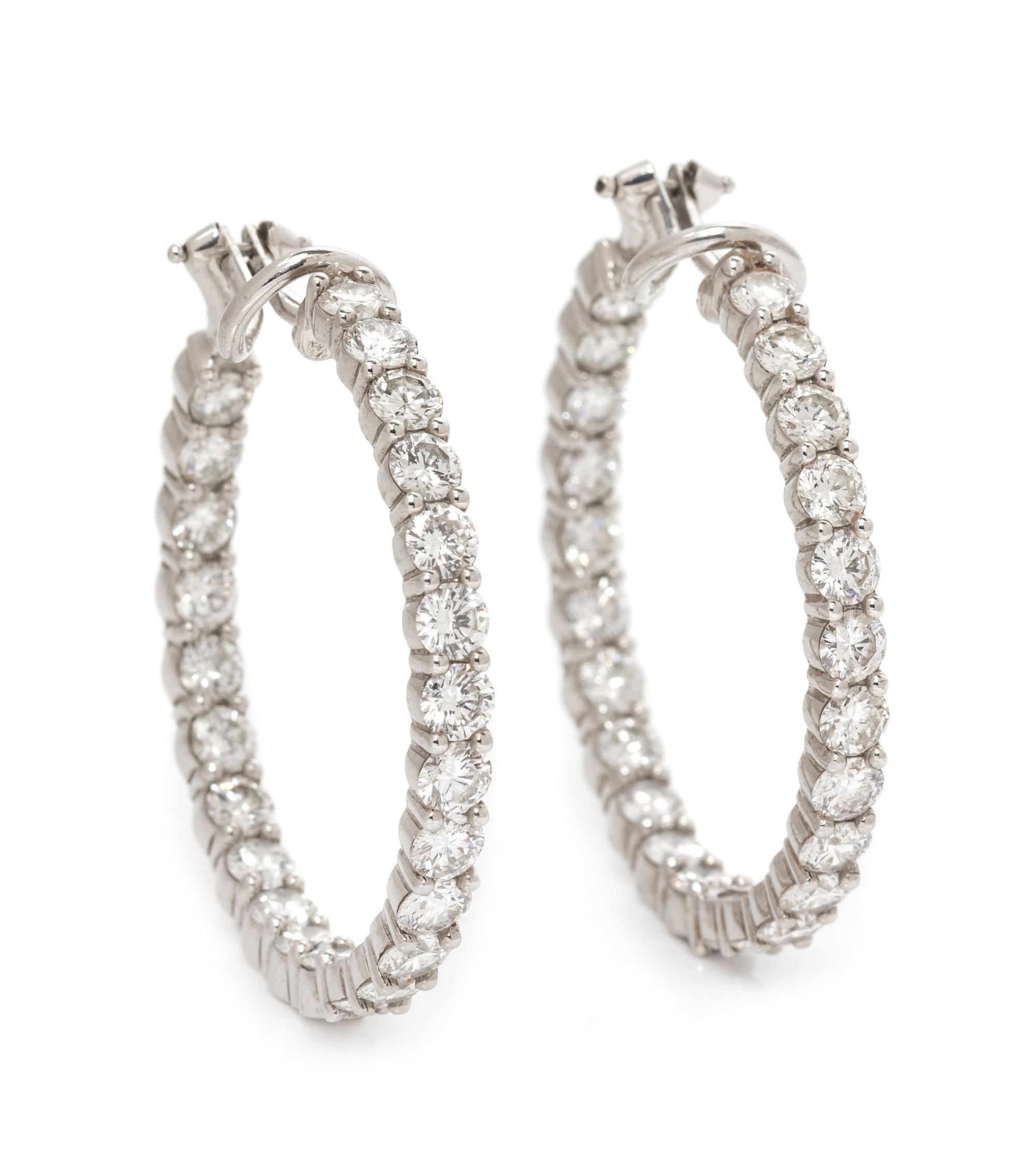 A Pair of White Gold and Diamond Hoop Earclips, 9.70 dwts.