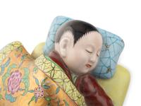 A Pair of Herend Porcelain Sleeping-Child Figures