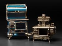 A Qualified Range Co. Salesman Sample Stove and a Rival Toy Stove