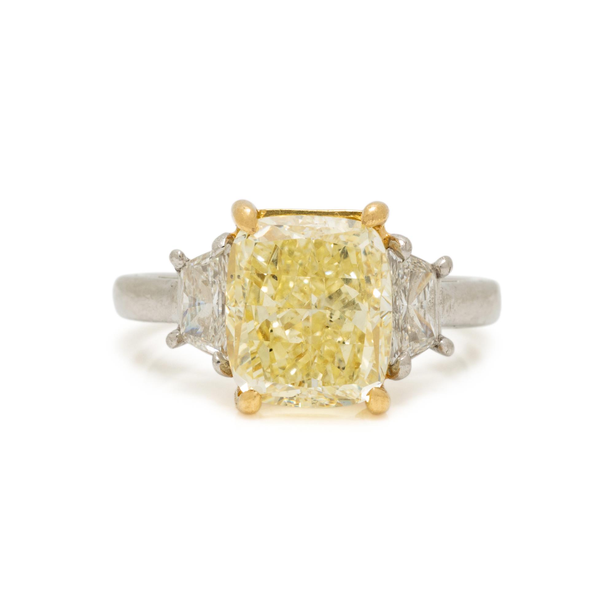 FANCY LIGHT YELLOW DIAMOND AND DIAMOND RING