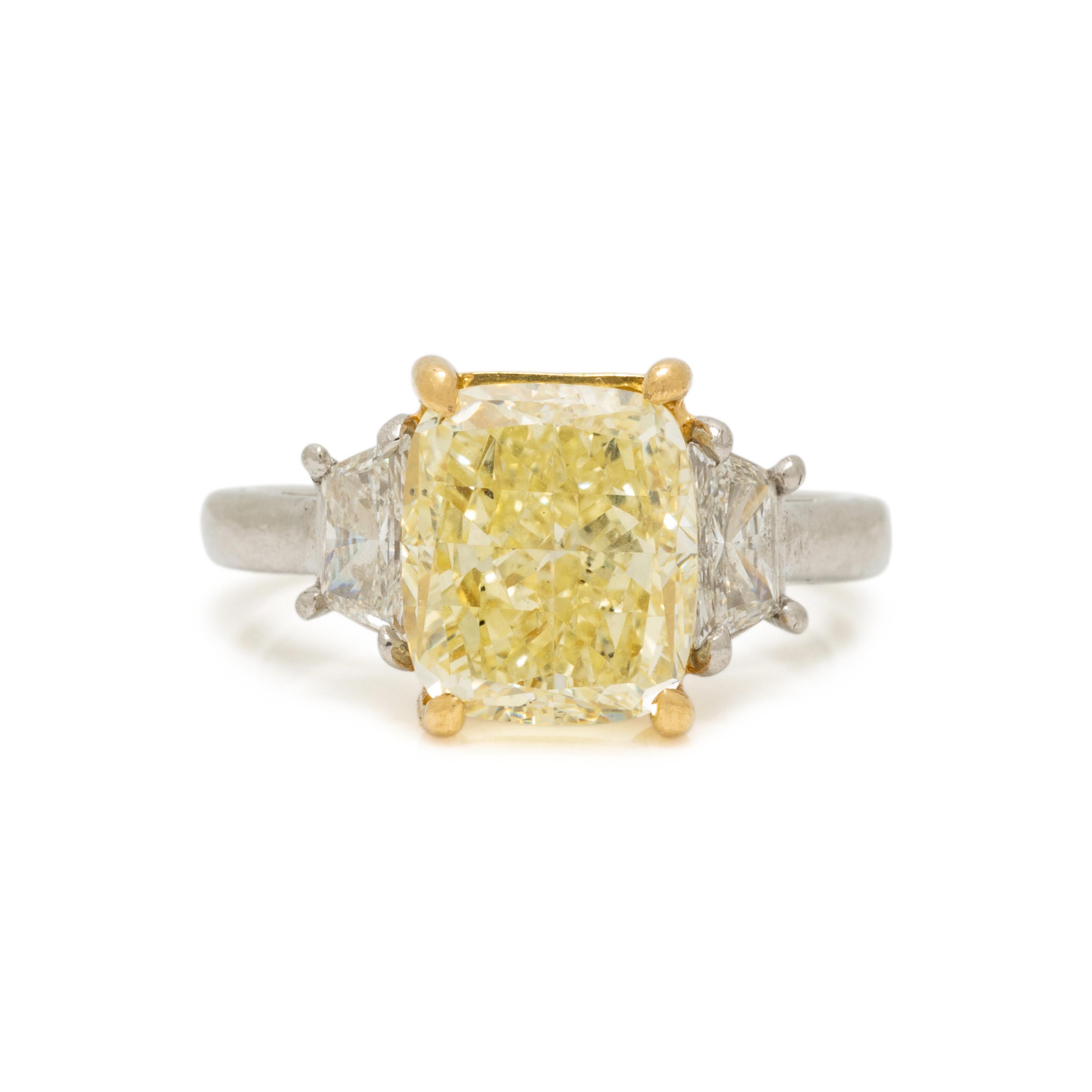 FANCY LIGHT YELLOW DIAMOND AND DIAMOND RING
