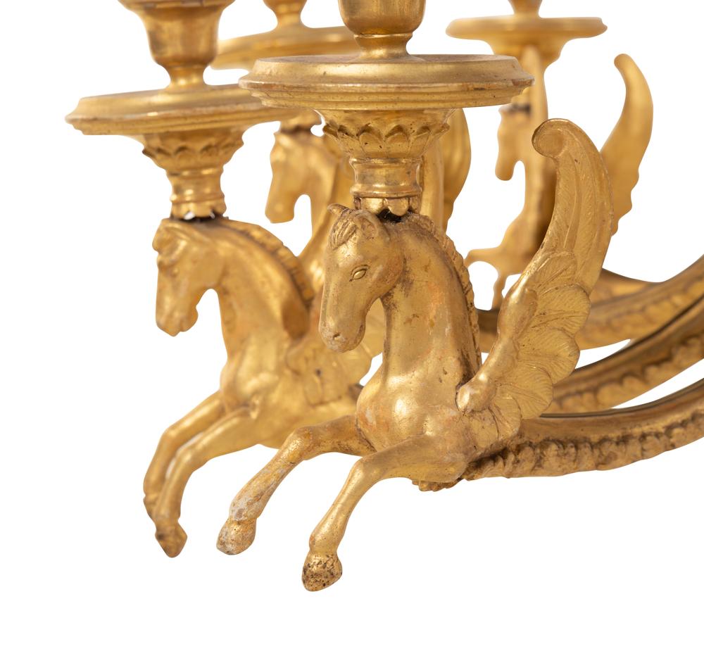 An Empire Giltwood Twelve-Light Chandelier