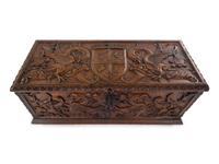 A Continental Carved Walnut Cassone