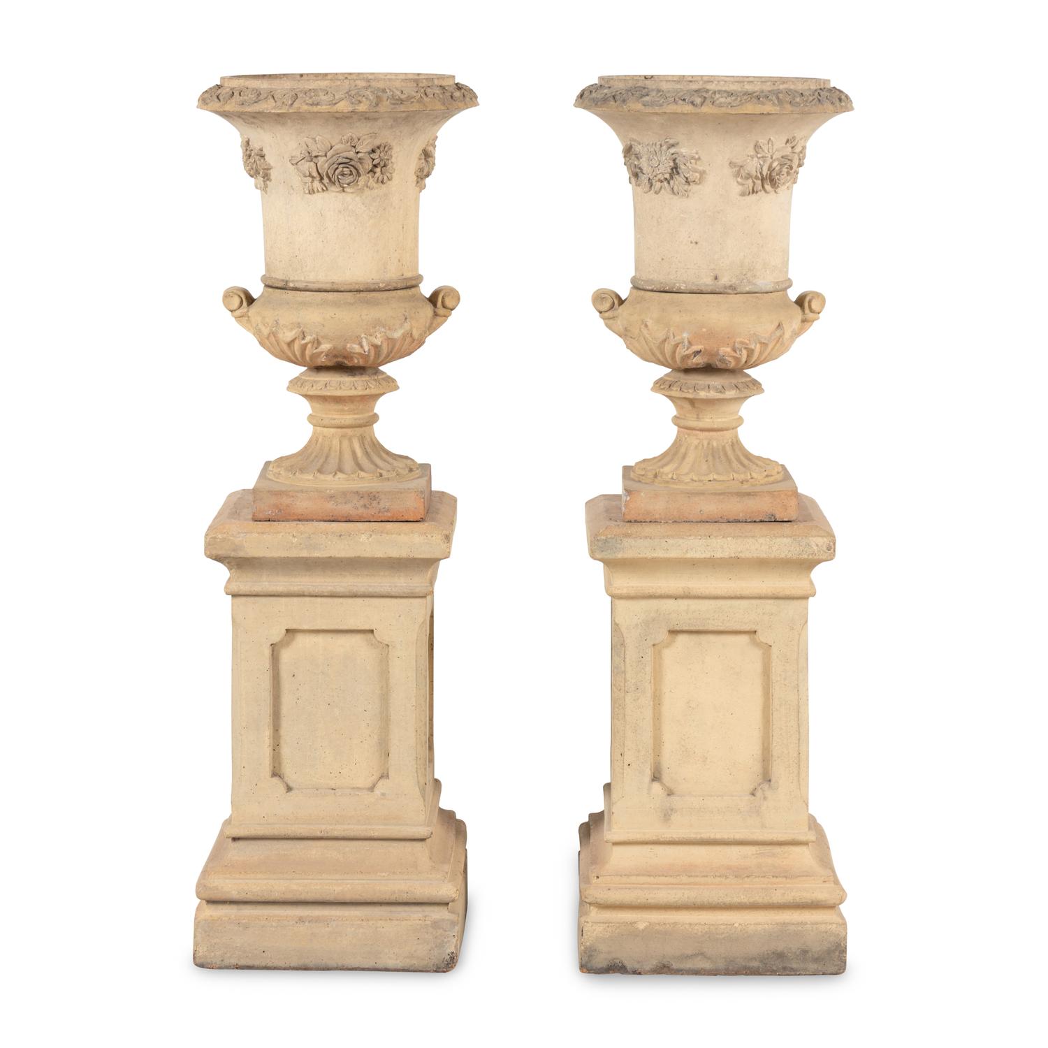 A Pair of Terra Cotta Garden Urns and Plinths